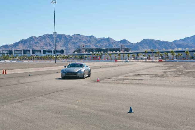 Las Vegas Sun writer John Katsilometes drives the Aston Martin Vantage S on the track at Exotics Racing Las Vegas, Thursday Oct. 15, 2012.